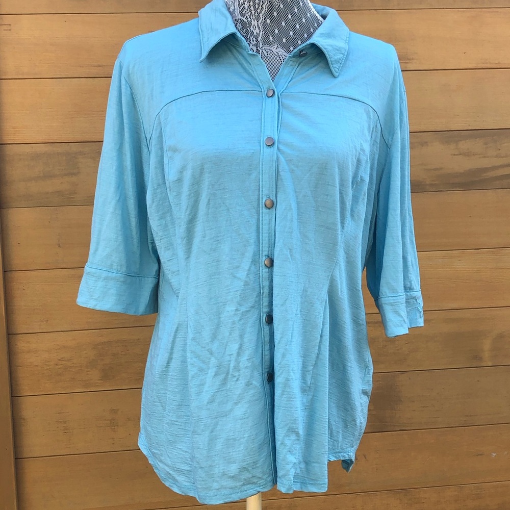 Light blue button down short sleeve shirt in merino wool by Ibex. Minor flaws.